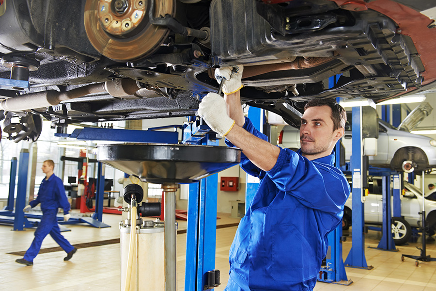 Mechanic servicing a vehicle in Trecek Auto Portage 